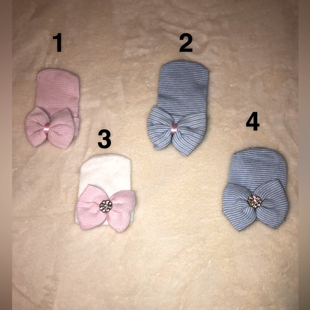 Baby girl receiving hats with bow